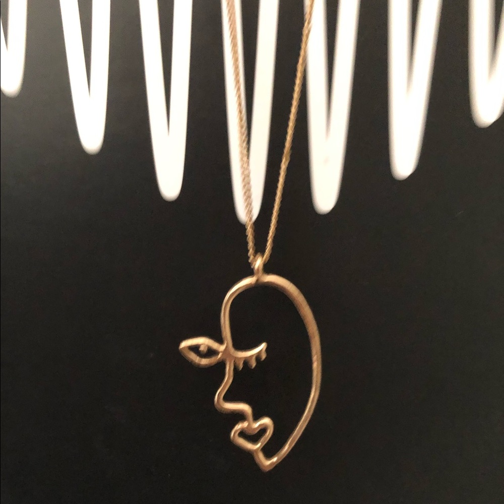 gold abstract face necklace